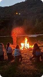 Campfire gathering at night